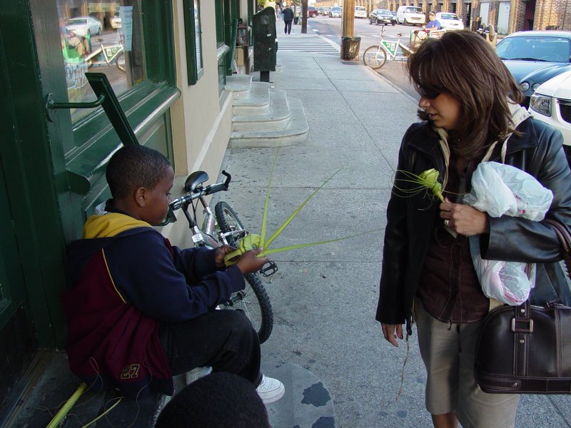 Maria buys a rose made of rushes
