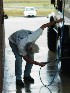 Robert washing off the sink hole