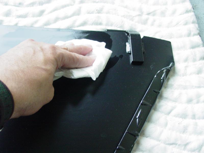 Using Isopropyl Alcohol to clean residue from door