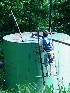 Tom on Tank near Oil Rig