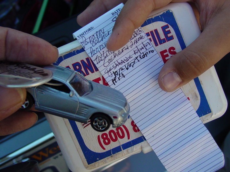 Ted Signing Log Courthouse log with Crossfire Travel Bug