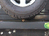 Rear outlet below spare