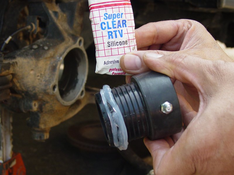 Putting Silicon adhesive on Axle Tube end seal