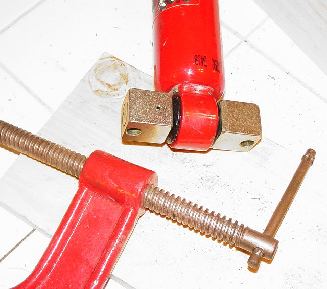 Installed Bushing and Bar Pin Eliminator with the C-clamp