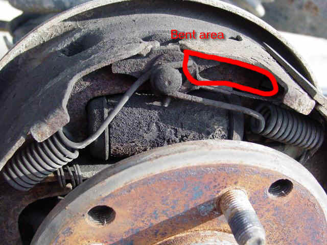 Bent section of metal shoe assembly