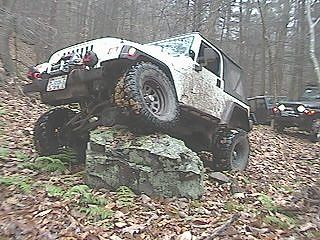 Jim picking rocks out of his tire