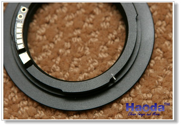 Haoda M-42 to Canon EOS electronic mount adapter with autofocus confirmation.