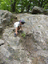Tom climbing down the obstacle