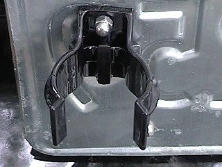 Detail of Mag Lite clip attached to spare license plate